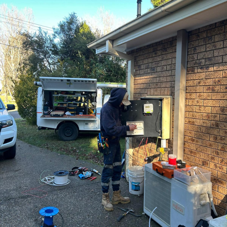 An Eddy Cullen Electrical property management electrician working on a faulty switchboard.