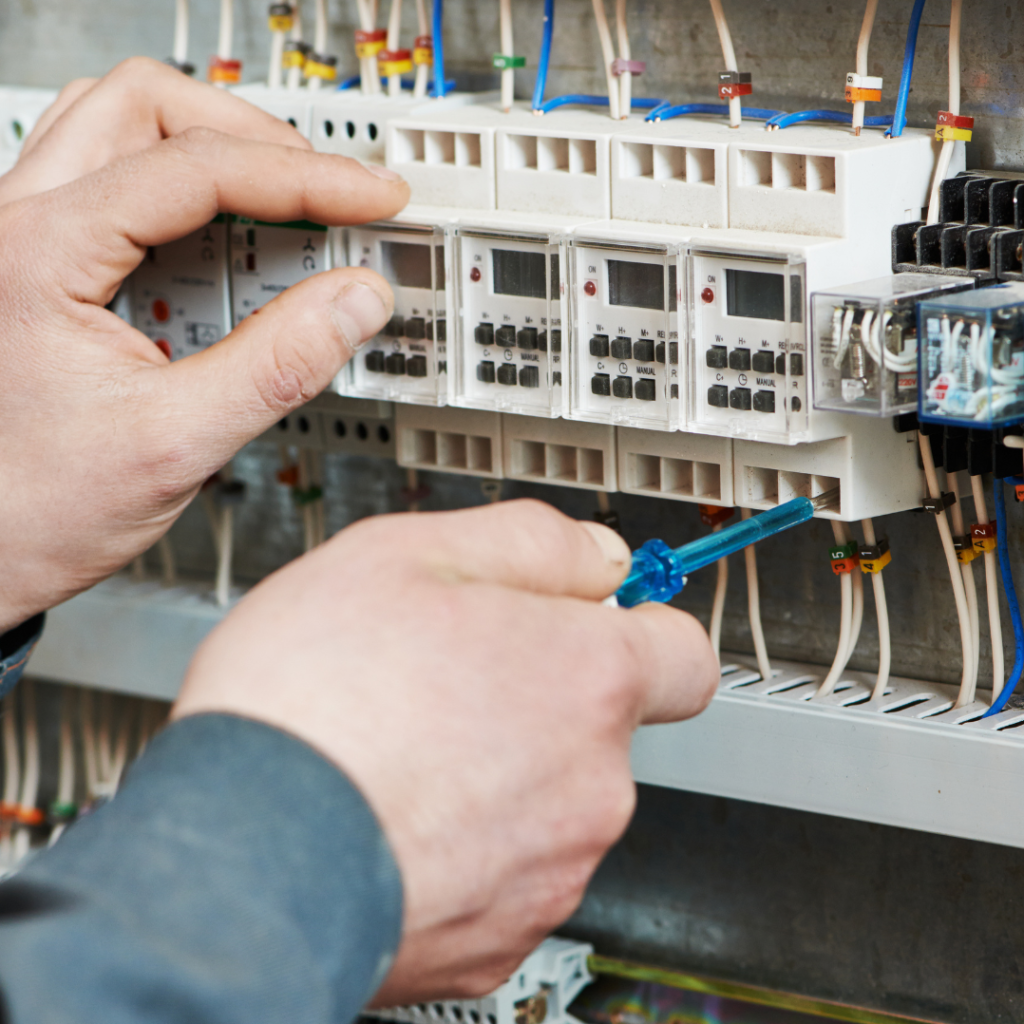 An Eddy Cullen emergency electrician conducting a circuit overload repair.